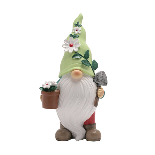 A Gonk garden ornament carrying a trowel and a flower pot.