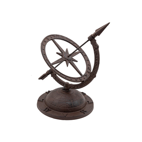 A cast iron sun dial with a compass and globe design on the base with an arrow style sundial on top.