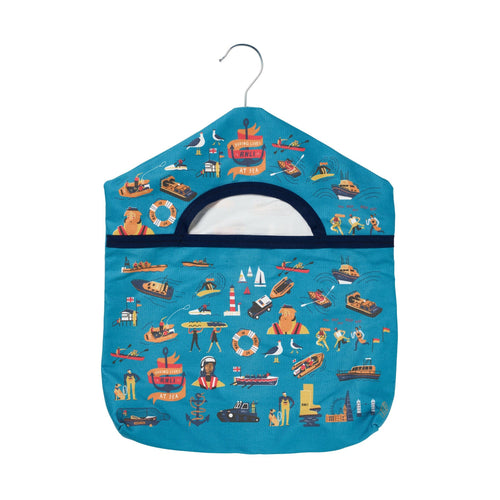 A blue peg bag with hanger with illustrations of RNLI lifeboats, kit and crew.