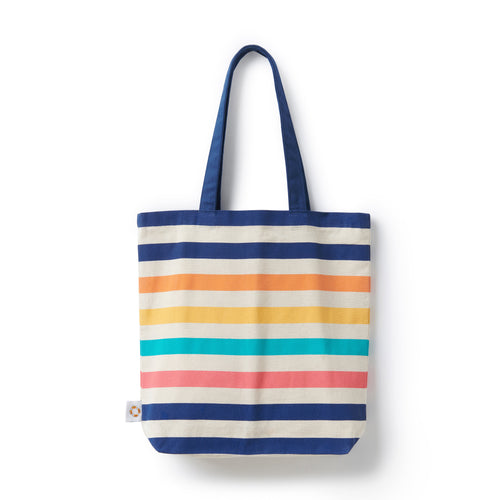 A tote bag with navy handles and a bright stripe pattern.