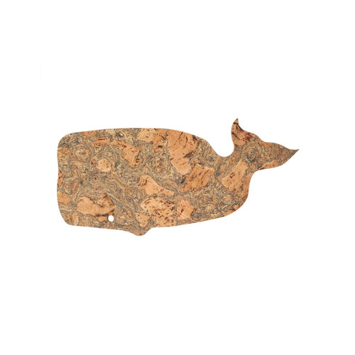 A cork trivet in the shape of a Whale.