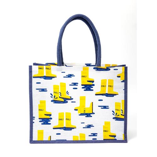 A shopper bag with handles, featuring an all-over print of RNLI yellow wellies.