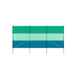 A green and blue striped windbreak with four bamboo poles.
