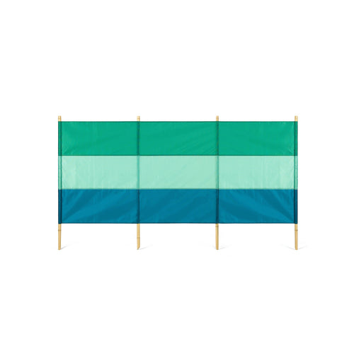 A green and blue striped windbreak with four bamboo poles.