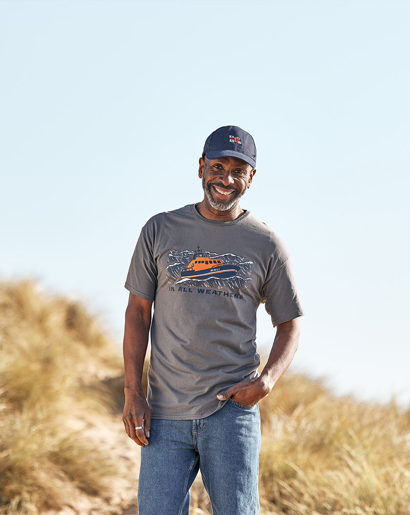  Model wearing RNLI's 'in all weathers' T-shirt and a 'Since 1824' Cap 
