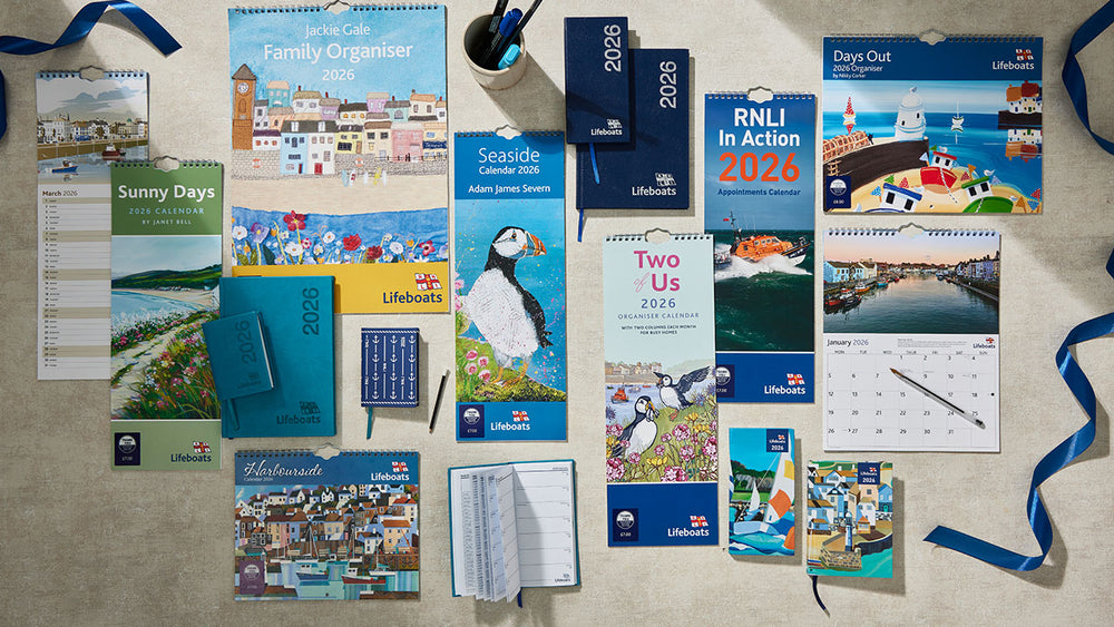  Collection mix of RNLI 2026 calendars and planners and diaries on a surface 