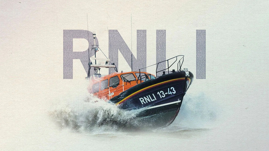 A lifeboat graphic with a wave breaking on the bow and the text, 