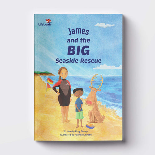 An RNLI Children's book with a child's name personalised on the front with the title, "James and the Big Seaside Rescue". The illustration shows a reindeer, lifeguard and child on the beach.