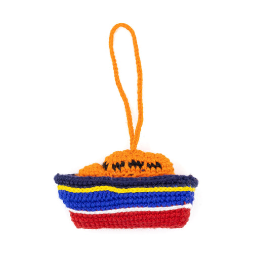 An orange, navy and red crochet RNLI Lifeboat Decoration.