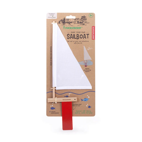 A make you own sail boat kit with a white sail and red rudder.
