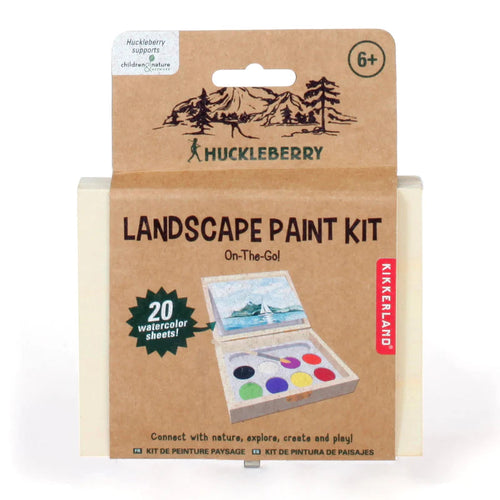 A wooden box containing a painting kit and watercolour paper.