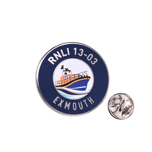 An RNLI Launch a Memory Exmouth Pin Badge in navy, silver and orange.