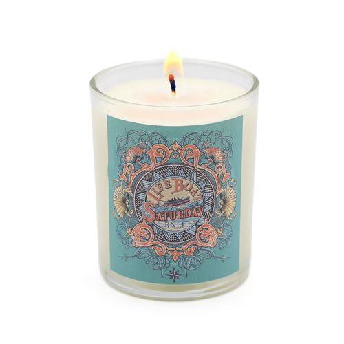 A glass candle with an RNLI design on the front. 