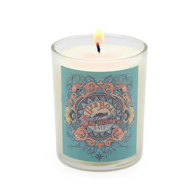 A glass candle with an RNLI design on the front. 