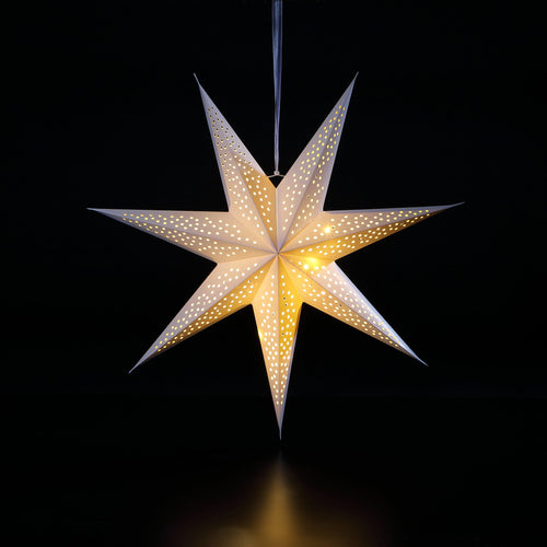 A lit, 3D paper star hanging from a white ribbon. 