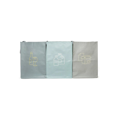 Three folded bags for storing recycling. 