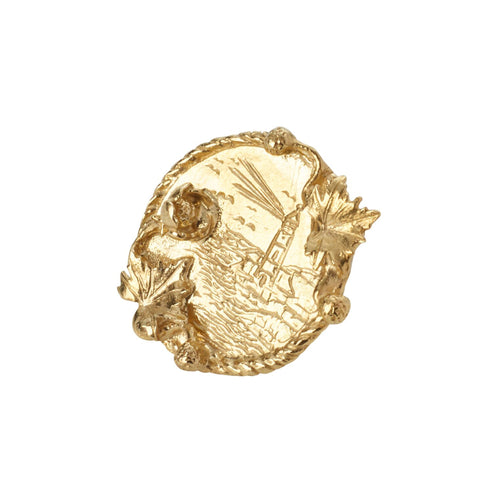A gold brooch with an intricate coastal design on it, made by Alex Monroe as part of the RNLI 200 Limited Collection.