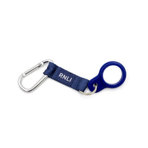 A navy RNLI Bottle Carrier with a metal carabiner clip.