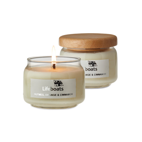 RNLI Nutmeg Orange and Cinnamon Pop Candle in a glass jar with a wooden lid.