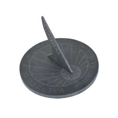 A round slate sundial with Roman numerals marking the clock face