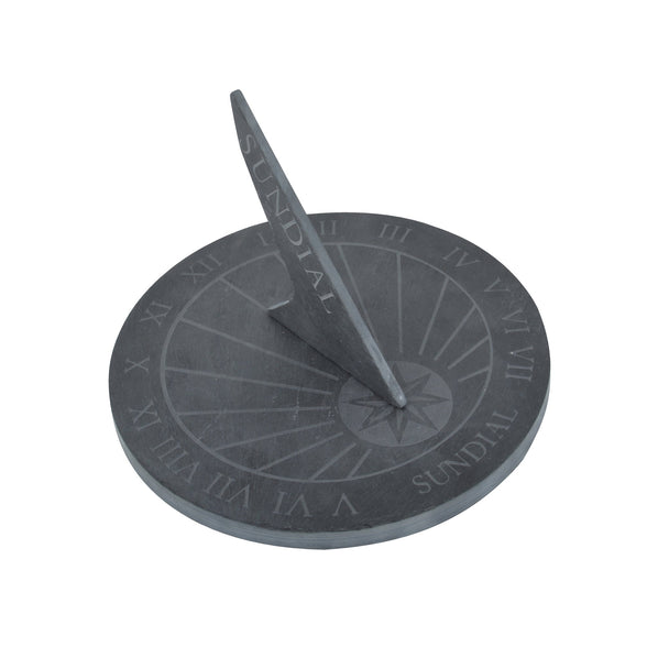 A round slate sundial with Roman numerals marking the clock face
