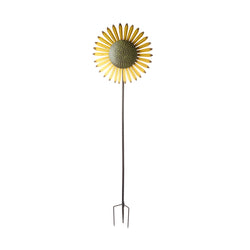 A sunflower windmill on a tall garden stake.
