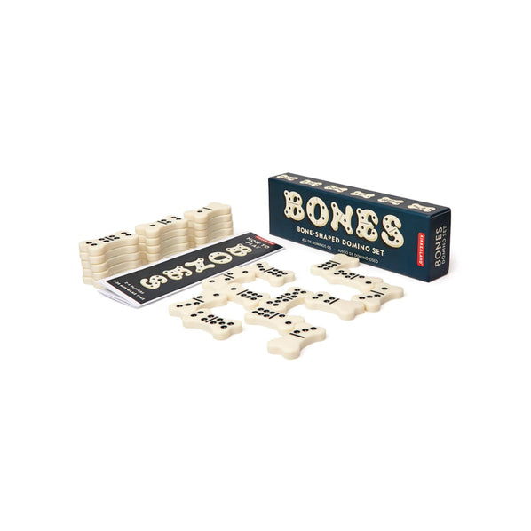 Kikkerland Bones Domino Set with a dark navy box and white tiles with black dots.