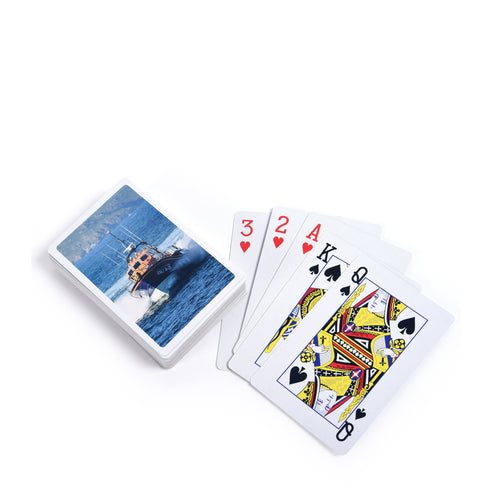 A set of playing cards with photographs of RNLI lifeboats on the reverse.