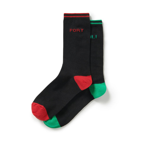 A pair of Men's socks in black. The right foot has red contrasting details and says, 