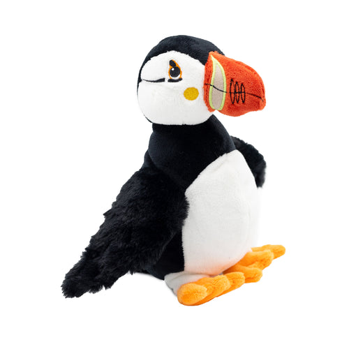 A puffin toy with an orange beak and yellow feet.