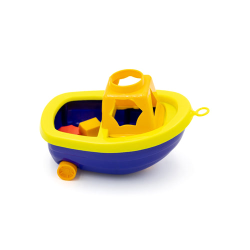 RNLI Bioplastic Boat Toy with Shapes. A yellow and navy boat with a cabin at the front. The cabin has shaped holes through which the corresponding block can be passed.
