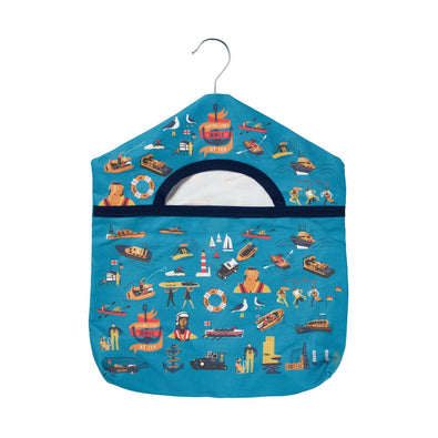 A blue peg bag with hanger with illustrations of RNLI lifeboats, kit and crew. 
